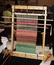 A standard size loom with a rug in progress