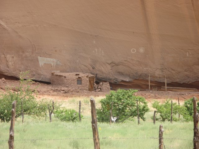 A Navajo hogan including the walls of an earlier Anasazi structure
