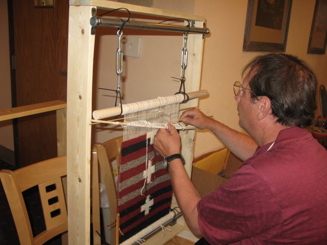 Bob Rosen nears completion on his rug.  