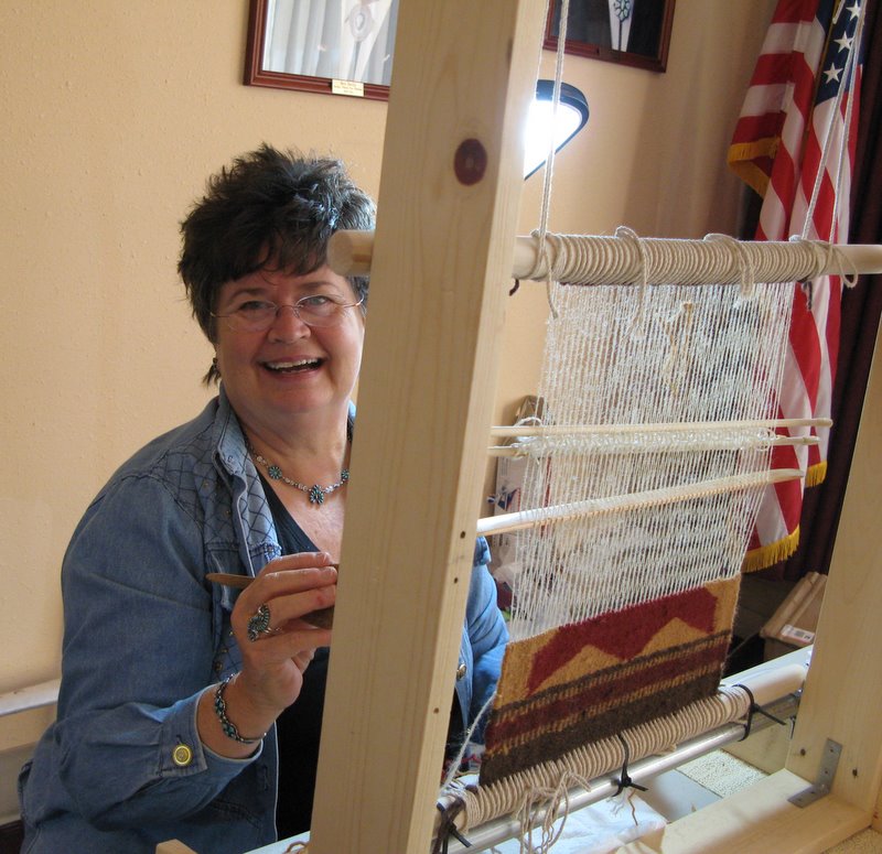 Mary Falzone works on her Teec Nos Pos inspired motif.  