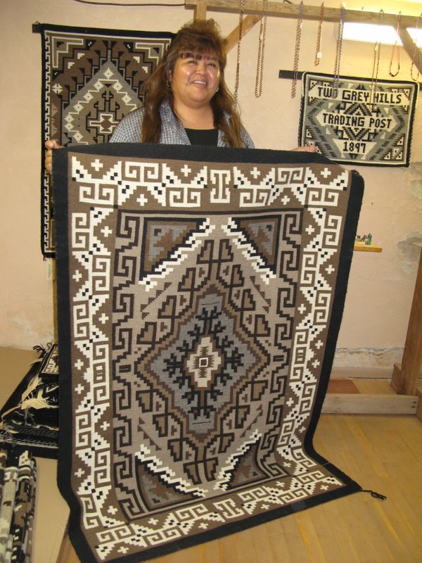 Shirley Brown with her handspun and handcarded Two Grey Hills rug. 