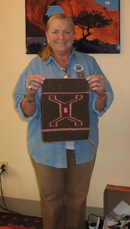 Rosemary Morrill shows off her newly finished rug! 
