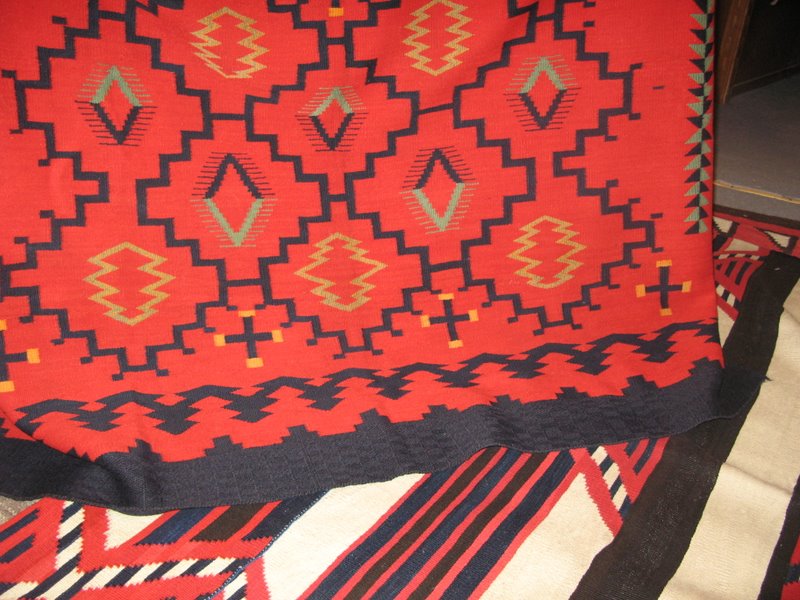 The blanket in the top part of the picture is also raveled bayeta and features a unique twill band.
