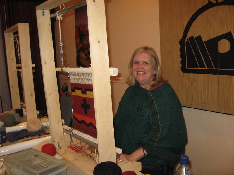 Barbara Nicodemus nears completion of her weaving project.