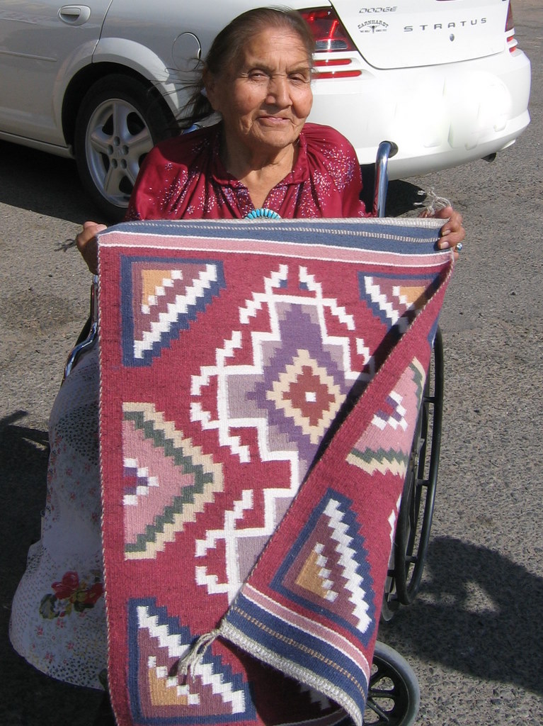 Bah Yazzie Ashley with a small Burntwater rug