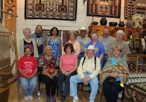 Here's our class with 95 year old trader, Bill Richardson and the Brown family of weavers.