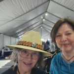 I purchased a beautiful yellow cedar hatband from Teresa and Loa Ryan. I'm on the left, and Teresa is on the right.