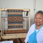 Gloria Begay's Chief Blanket Variant design is done with yarns naturally dyed with cochineal, indigo, rabbitbrush, Navajo tea, and ground lichen.
