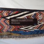 Tyrell used individual wool locks on the lower edge of the weaving.