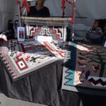 Renowned pictorial weavers Louise Nez and her daughter Laverne Greyeyes shared a booth. Check the details of both pictorials